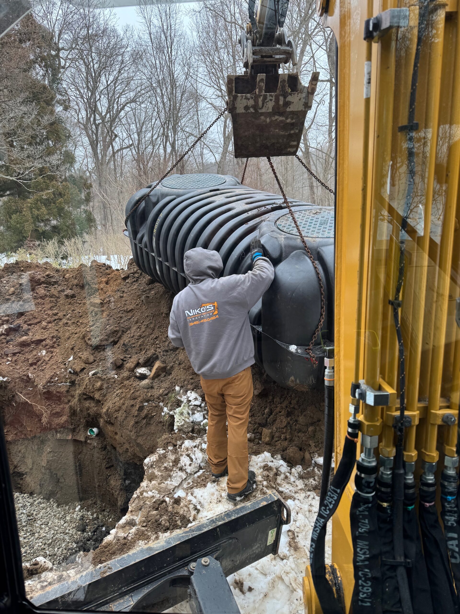 Nikos Equipment Services septic repair crew working in Dutchess County NY
