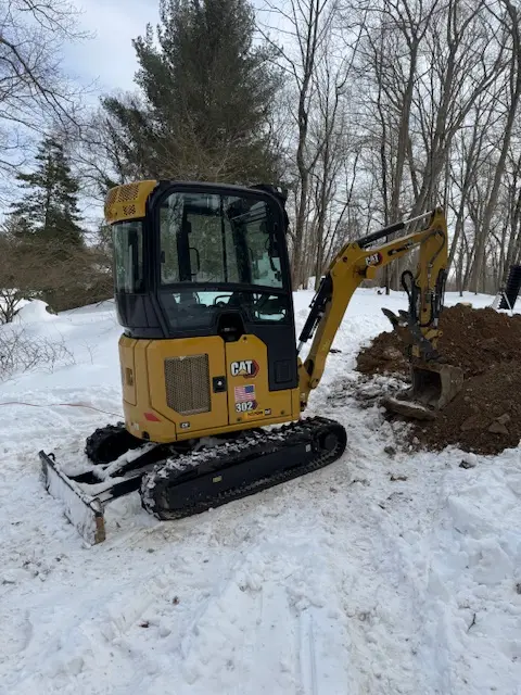 Final grading on a completed Hudson Valley job site