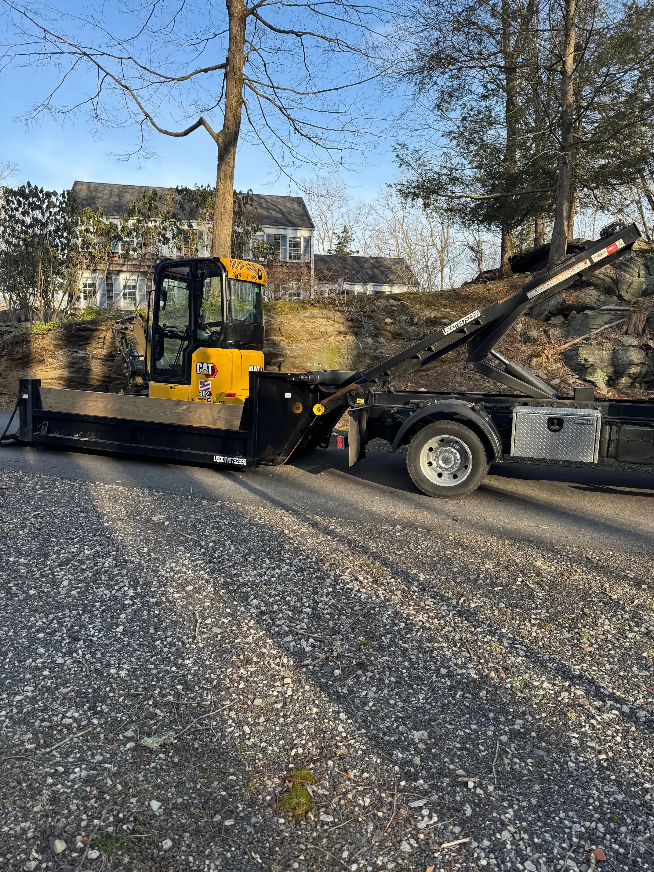 Excavation work with backhoe on a residential property