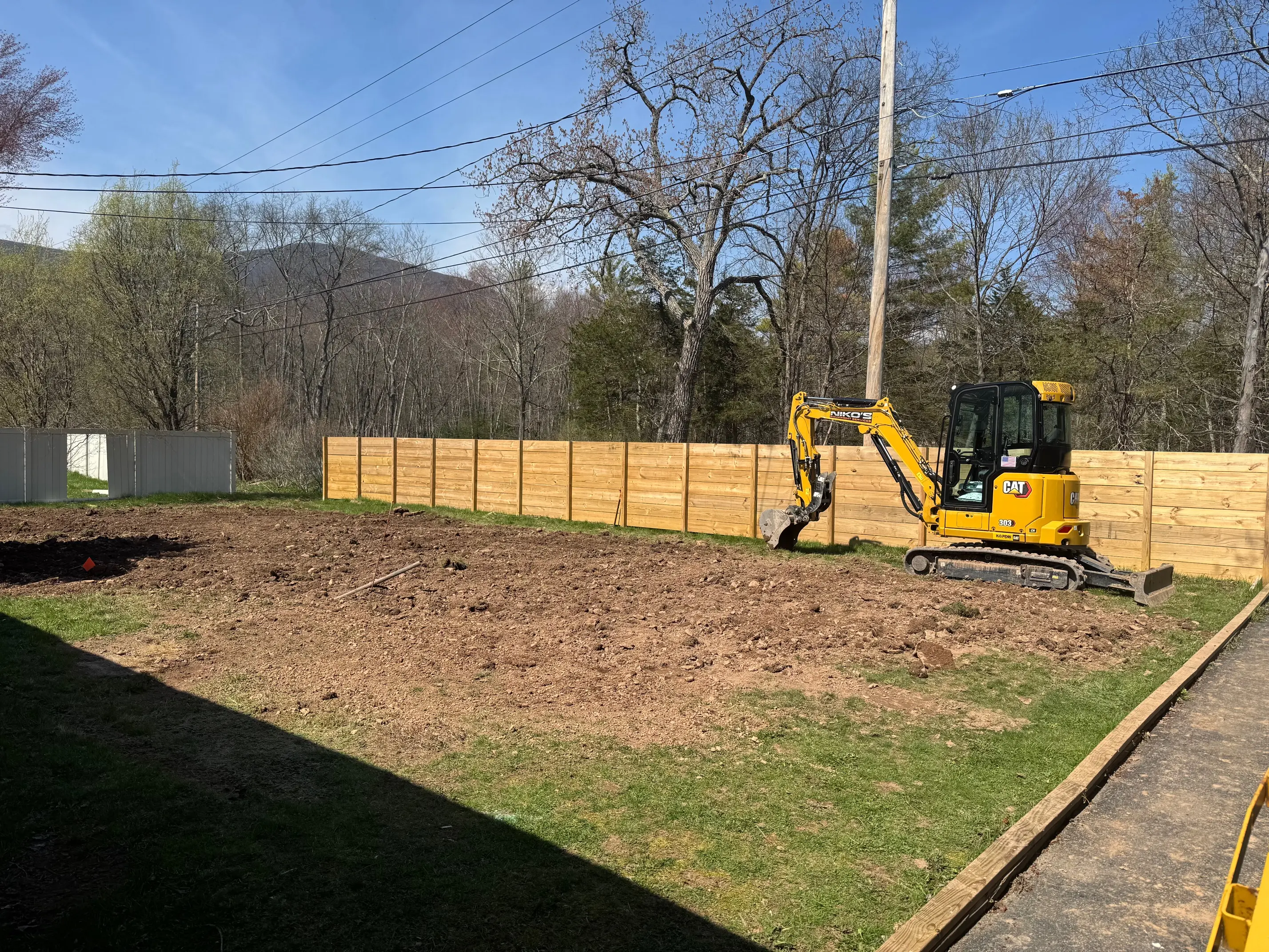Excavator at work on a Hudson Valley residential site