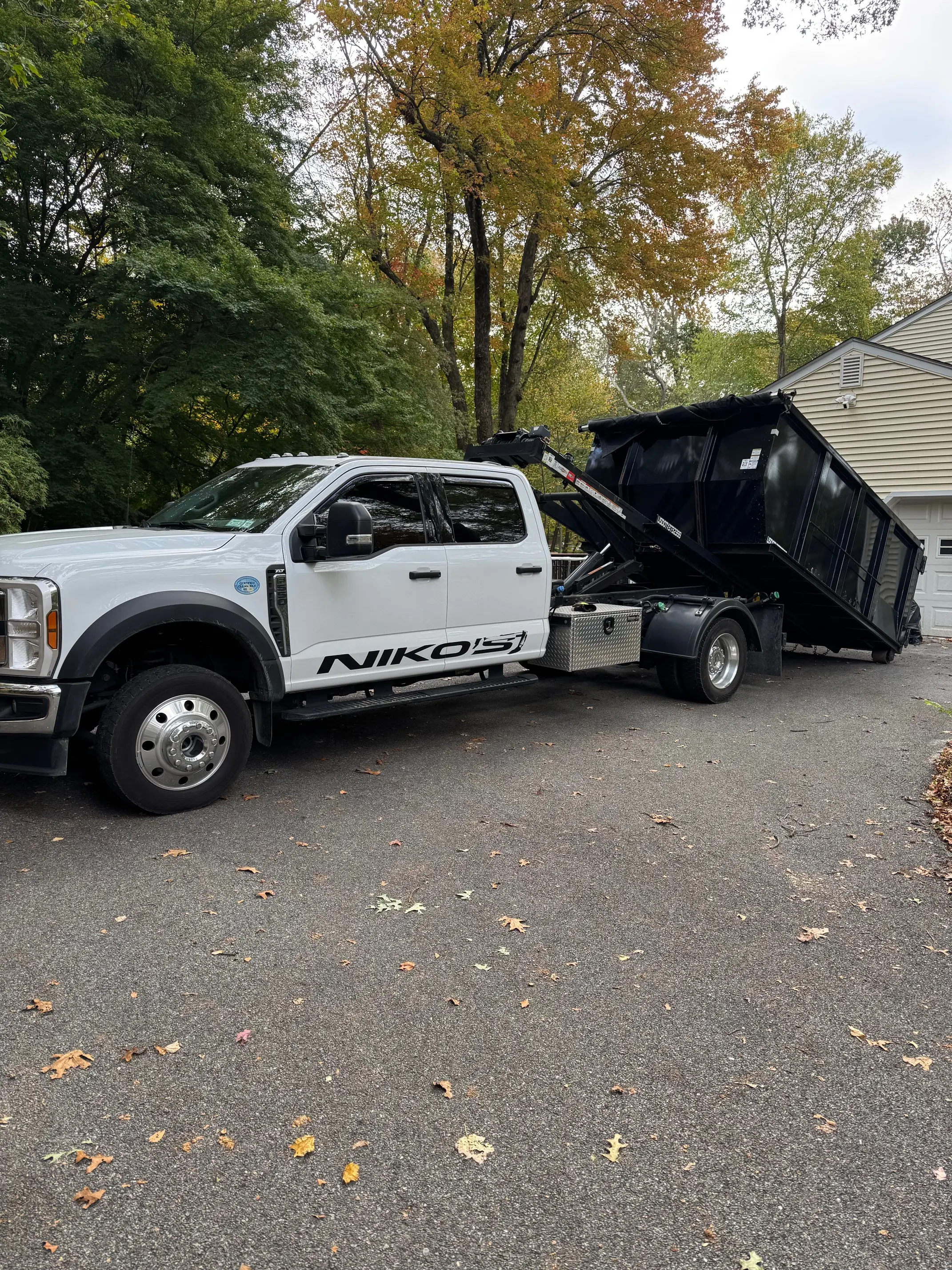 Roll-off dumpster on driveway